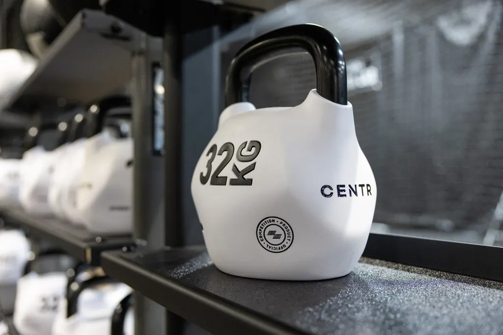 White 32 kg competition kettlebell racked at DPS