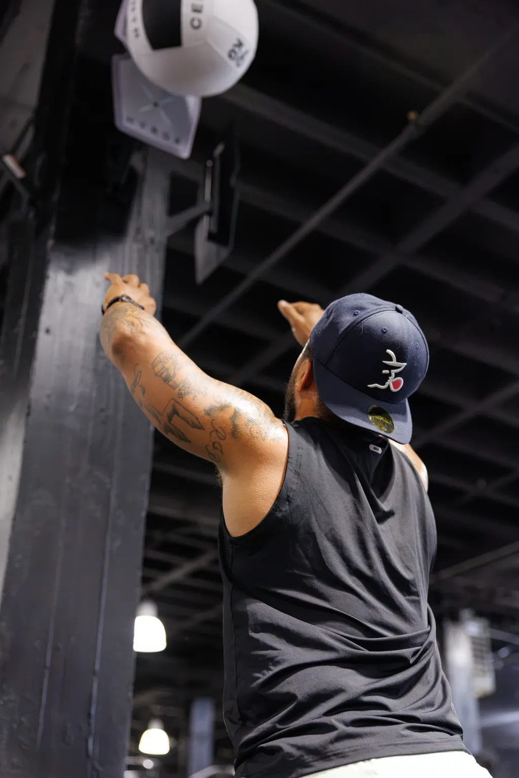 Athlete throwing a wall ball toward the target during HYROX training at DPS
