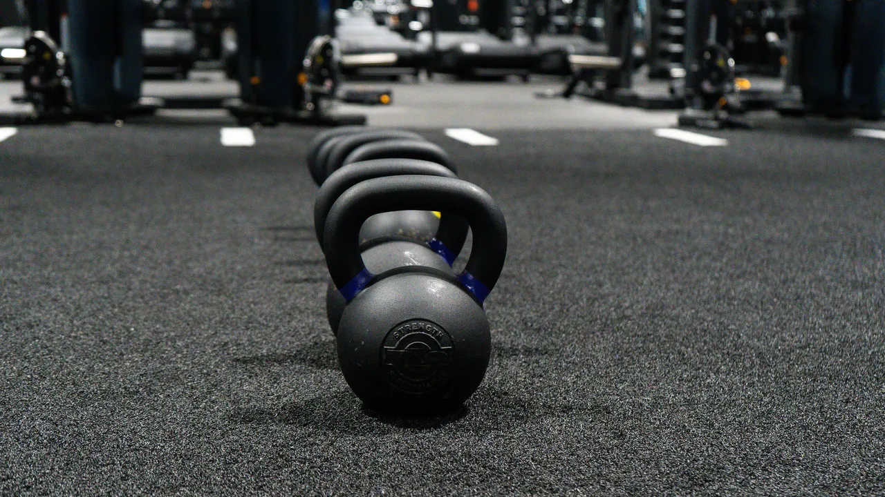Kettlebells lined up on the training floor