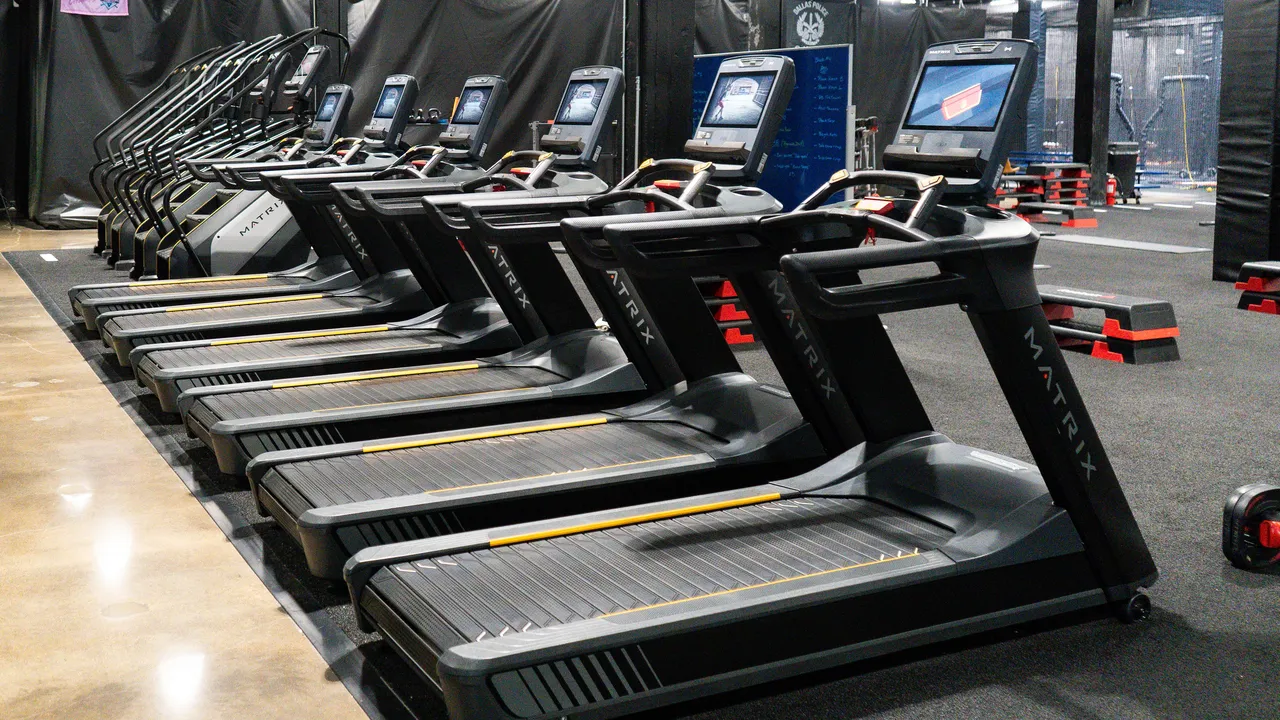 Row of Matrix treadmills on the cardio deck